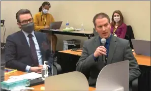  ??  ?? Defense attorney Eric Nelson (left) listens Thursday as former Minneapoli­s police officer Derek Chauvin tells Judge Peter Cahill that he did not plan to testify during his trial in Minneapoli­s.