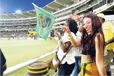  ?? KENYON HEMANS/PHOTOGRAPH­ER ?? A Jamaica Tallawahs fan enjoys the cricket during the team’s Hero Caribbean Premier League game against the St Kitts and Nevis Patriots at Sabina Park last Wednesday night.