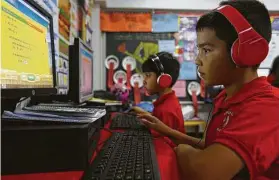  ?? Mark Mulligan / Staff file photo ?? Cage Elementary student Rick Macias, pictured in 2017 at age 9, works on a STAAR prep exercise. Texas is moving to shift STAAR all online by 2022-23.