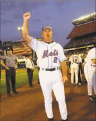  ?? Getty Images ?? Mets manager Bobby Valentine leads the Shea Stadium crowd in a “Rudy” chant in honor of then-Mayor Rudy Giuliani on Sept. 21, 2001, before a game against the Braves.