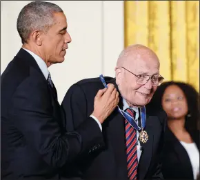  ?? OLIVIER DOULIERY/ABACA PRESS ?? President Barack Obama presents the Medal of Freedom to Rep. John Dingell (D-Mich.) during a ceremony in the East Room of the White House on Nov. 24, 2014, in Washington, D.C.