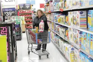  ?? — Reuters ?? A woman shops at a Walmart in Westbury, New York, US.