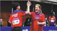  ?? GAO ERQIANG / CHINA DAILY ?? Ping-pong players from China and the United States celebrate in Shanghai on Saturday during a friendly match marking the 50th anniversar­y of the two countries’ Ping-Pong Diplomacy.