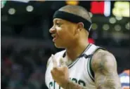  ?? MICHAEL DWYER — THE ASSOCIATED PRESS ?? Boston Celtics’ Isaiah Thomas points to his mouth after losing a tooth during the first quarter of a secondroun­d NBA playoff series basketball game against the Washington Wizards, Sunday, April, 30, 2017, in Boston.