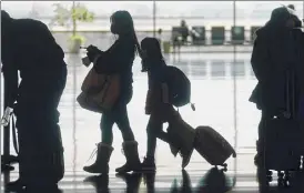  ?? Rick Bowmer / Associated Press ?? Airlines and others in the travel industry are throwing their support behind vaccine passports to boost pandemic-depressed travel.