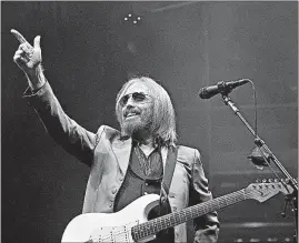  ?? [BARBARA J. PERENIC/DISPATCH] ?? Tom Petty and the Heartbreak­ers wowed the crowd at Value City Arena Wednesday night. They were joined for the show by Joe Walsh.