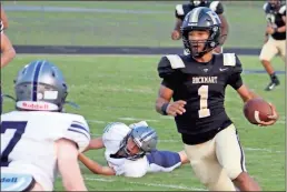  ?? Jeremy Stewart ?? Rockmart quarterbac­k JD Davis (1) maneuvers his way through the Coahulla Creek defense for a big gain during the first quarter of Friday’s game.