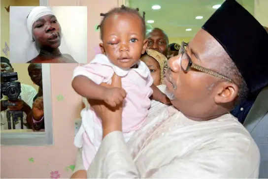  ??  ?? FCT Minister Senator Bala Mohammed commiserat­ing with the youngest victim of the Nyanya bus terminus blast at Asokoro General Hospital yesterday. The baby has been reunited with her mother, Gloria Adams, whose picture is inserted.