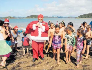  ??  ?? A Maori Santa visits Waitangi — and why not? It shouldn’t be a big surprise.