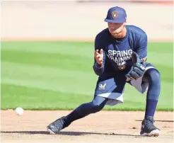 ?? ROY DABNER / FOR THE JOURNAL SENTINEL ?? Brewers shortstop Orlando Arcia works out during infield drills at Maryvale Baseball Park in Phoenix on Thursday.