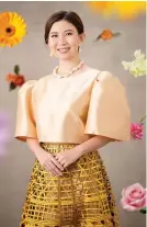  ?? ?? Rheumatolo­gist and medical professor Geraldine Zamora’s elegant Filipinian­a ensemble features a gold mestiza top, yellow laser-cut skirt with baroque pearls.