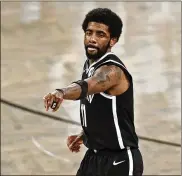  ?? ADAM HUNGER / AP ?? Brooklyn begin the season without star guard Kyrie
Irving, who has not met the city’s vaccine mandate. Irving and other unvaccinat­ed players around pro sports don’t get paid for the time they miss.