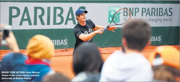  ??  ?? READY FOR ACTION: Andy Murray draws in the crowd during practice yesterday at Roland Garros