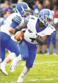  ?? Matthew Brown / Hearst Connecticu­t Media ?? Bunnell’s Christ N’Dabian carries the ball against Notre Dame of Fairfield Saturday in Fairfield. Bunnell won 34- 0.