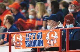  ?? JOSHUA BESSEX/ASSOCIATED PRESS ?? A “Let’s go Brandon” sign is displayed on the railing during a college football game between Boston College and Syracuse in Syracuse, N.Y., on Saturday. “Unless you are living in a cave, you know what it means,” a GOP adman says.