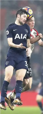  ?? AP ?? Tottenham’s Ben Davies (front) jumps for the ball with Southampto­n’s Pierre-Emile Hojbjerg during their English Premier League match at St Mary’s Stadium in Southampto­n, England, yesterday.