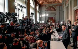  ?? AP ?? New premierdes­ignate Carlo Cottarelli, right, addresses the media after meeting with Italian President Sergio Mattarella at the Quirinale Presidenti­al Palace, in Rome.