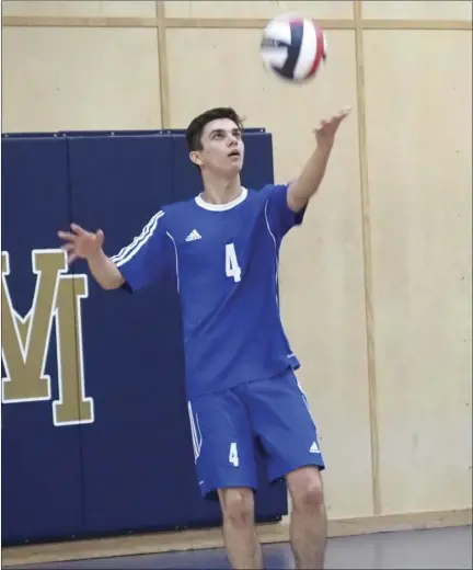  ??  ?? Vincent Memorial Catholic High School’s Alejandro Bryan prepares to deliver a serve during the Scots’ first round CIF-San Diego Section Div. IV playoff game against High Tech San Diego on Tuesday evening. KARINA LOPEZ PHOTO