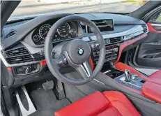  ??  ?? The interior of the X5 M features plenty of red trim.