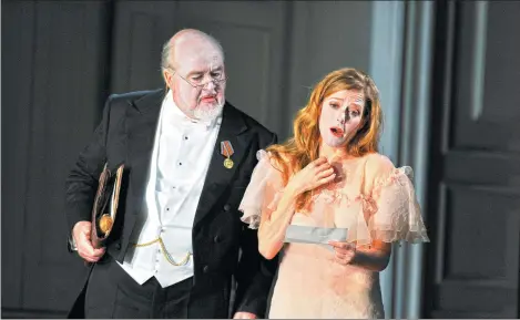  ?? ROBBIE JACK / CORBIS VIA GETTY IMAGES ?? Kim Begley as Polonius and Barbara Hannigan as Ophelia in Glyndebour­ne’s production of Brett Dean’s Hamlet.