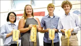  ?? Photo by Mike Eck ?? Five honor graduates of Decatur High School received their gold sash and cords during the 2017 Decatur Awards Ceremony at Peterson Gym in Decatur May 8. The honor students included Shaney Lee (left), Cameron Shaffer, Bracy Owens, Ryan Shaffer and Dylan...