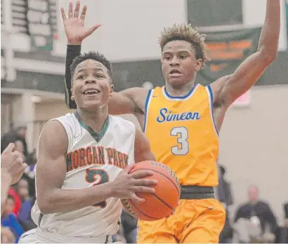  ?? | WORSOM ROBINSON/ FOR THE SUN- TIMES ?? Morgan Park’s Charlie Moore and Simeon’s Evan Gilyard will face each other for the third time Friday.