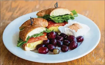  ?? CONTRIBUTE­D BY HENRI HOLLIS ?? Curried chicken salad on a croissant at Cafe at Pharr.