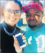  ??  ?? CELLPHONE RETURNED: Micaela de Sousa holds her mother’s cellphone, which taxi driver Adam Daniels found and returned to the family