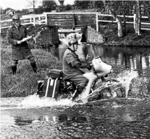  ??  ?? An AA patrolman negotiates the ‘water barrier’ during an AA solo motorcycle course at the associatio­n’s Patrols Training School at Widmerpool Hall, Nottingham­shire. The instructor keeping an eagle eye was R Farley of the Maidstone area.