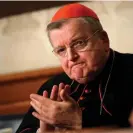  ?? Alessandra Tarantino/AP ?? Raymond Burke applauding during a news conference in Rome in 2018. Photograph: