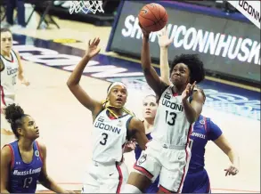  ?? David Butler II / USA TODAY ?? UConn’s Christyn Williams (13) shoots against UMass Lowell on Saturday in Storrs.