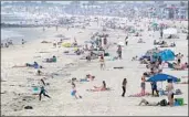  ?? Allen J. Schaben Los Angeles Times ?? NEWPORT BEACH crowds prompted Gov. Gavin Newsom to close all Orange County beaches.