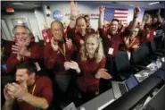  ?? LOS ANGELES TIMES VIA AP — THE ASSOCIATED PRESS ?? Engineers celebrate as the InSight lander touch downs on Mars in the mission support area of the space flight operation facility at NASA’s Jet Propulsion Laboratory Monday in Pasadena.