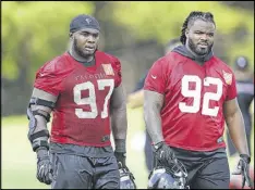  ?? CURTIS COMPTON / CCOMPTON@AJC.COM ?? Grady Jarrett (left) and newcomer Dontari Poe are expected to provide grit as the defense tries to regroup after its Super Bowl failure. Jarrett led the defensive line in snaps last season.