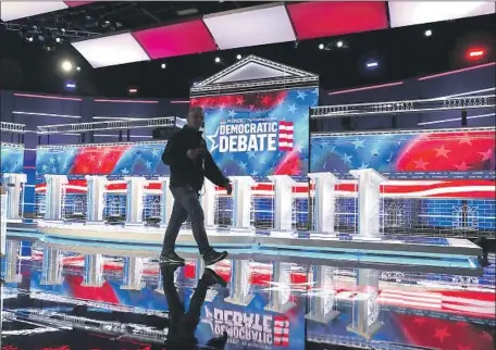  ?? Joe Raedle Getty Images ?? THE STAGE is set in Atlanta for the 10 Democratic presidenti­al candidates who have qualified for this month’s two-hour debate.