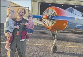  ?? PHOTO: CONTRIBUTE­D. ?? Qantas A330 pilot and Dubbo man Mark Benton, pictured with daughters Mia and Daisy, was temporaril­y laid off on March 7, due to COVID-19, and is making ends meet the best way he can, including doing food deliveries for Woollies.