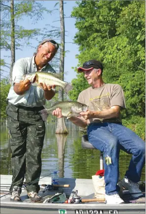  ?? PHOTOS BY KEITH SUTTON/CONTRIBUTI­NG PHOTOGRAPH­ER ?? When run-out fishing gets hot, two anglers casting side by side to the same spot will often pull out lunker largemouth­s like these caught by Ian Sulocki of Manaus, Brazil, left, and Gary Looney of Wynne.