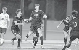  ?? MICHAEL LAUGHLIN/SOUTH FLORIDA SUN SENTINEL ?? Fort Lauderdale’s Aidan Binnion, center, celebrates his game-winning goal against St. Thomas Aquinas during the second half of their regional semifinal match Saturday at Inter Miami CF.