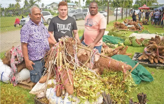  ?? Photo: Ronald Kumar ?? From left: Farmers Patrick Veu, Augustin Yabaki and John Ba with yams and taro they brought for the Fiji Rotuman Farmers Associatio­n backyard farmers yam, taro competitio­n 2022 at St. Marcellin School on May 14, 2022.