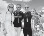  ?? ?? From left, Gloria Suarez, Miami Mayor Francis Suarez, Emelio Estefan, and Gloria Estefan pose at the Miami Grand Prix in Miami Gardens.