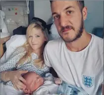  ?? THE ASSOCIATED PRESS ?? Chris Gard and Connie Yates with their son Charlie Gard at Great Ormond Street Hospital in London.