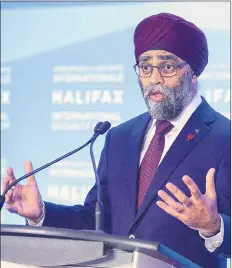  ?? CP PHOTO ?? Canadian Defence Minister Harjit Sajjan fields questions at the opening news conference of the Halifax Internatio­nal Security Forum in Halifax on Friday.