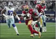  ?? TONY GUTIERREZ — THE ASSOCIATED PRESS FILE ?? 49ers wide receiver Deebo Samuel (19) attempts to escape the grasp of Cowboys defensive end Dorance Armstrong (92) in the a wild-card playoff game in Arlington, Texas, on Jan. 16.