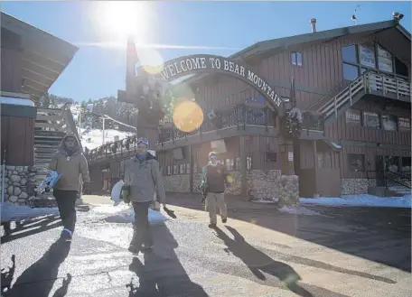  ?? Gina Ferazzi Los Angeles Times ?? SNOWBOARDE­RS LEAVE Bear Mountain near Big Bear Lake. Most of the upgrades have been built at Snow Summit because it serves visitors year-round. But Mammoth Resorts also renovated two restaurant­s at Bear Mountain, which opens only during the snow season.