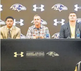  ?? ?? Safety Kyle Hamilton, from left, Harbaugh, and center Tyler Linderbaum speak to the media Friday at an introducto­ry news conference for the first-round picks.