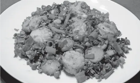  ?? [LINDA GASSENHEIM­ER/ TNS] ?? Scallop Fried Rice.