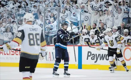  ?? JOHN WOODS THE CANADIAN PRESS ?? Jets’ Mark Scheifele reacts after scoring against the Vegas Golden Knights during second period of Game 1 action in the NHL’s Western Conference final in Winnipeg on Saturday. The Jets won the contest, 4-2, to draw first blood in the best-of-seven...