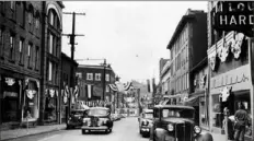  ?? Scottdale Historical Society ?? In 1949, Pittsburgh Street in Scottdale was decorated in red, white and blue bunting to celebrate the end of World War II and the borough’s 75th anniversar­y. This image is part of a World War II exhibition at Westover Museums.