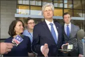  ?? BRIAN MELLEY — THE ASSOCIATED PRESS ?? U.S. Rep. Jeff Fortenberr­y, R-Neb., center, speaks with the media outside the federal courthouse in Los Angeles on Thursday.