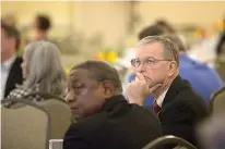  ?? Staff photo by Evan Lewis ?? Tim Wilson, director of Northeast Texas Small Business Developmen­t Centers in Mount Pleasant, Texas, and others listen to a presentati­on Thursday morning during the Governor's Small Business Forum at the Texarkana Convention Center. Area business...